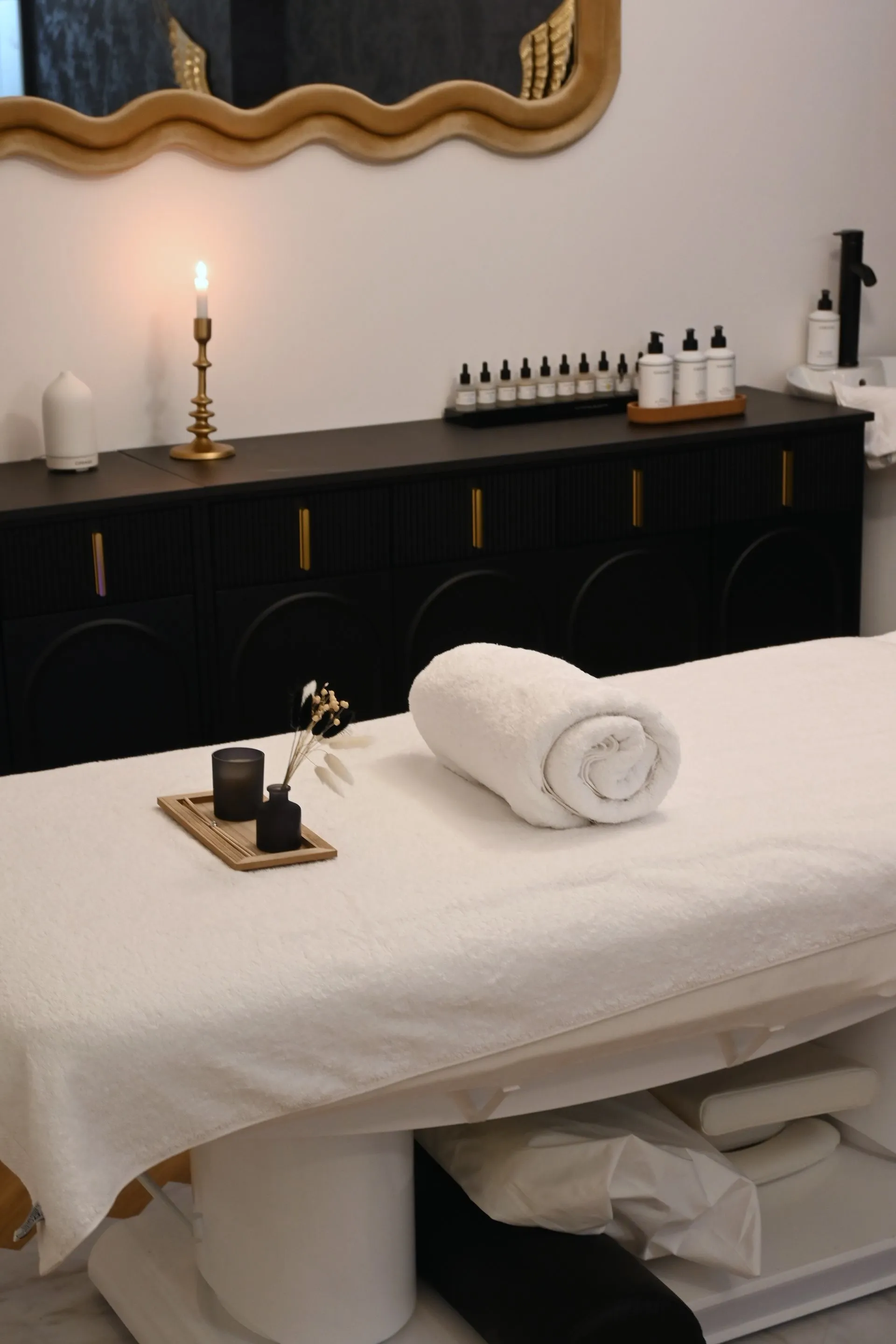 Folded white spa towels stacked and ready for use